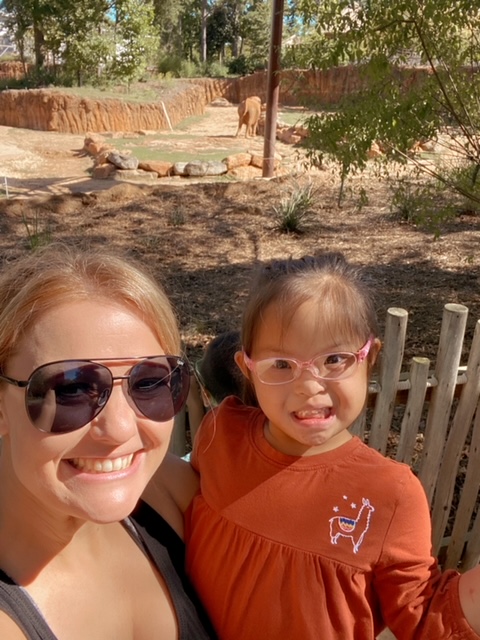 Mom and Daughter posing in front of elephants